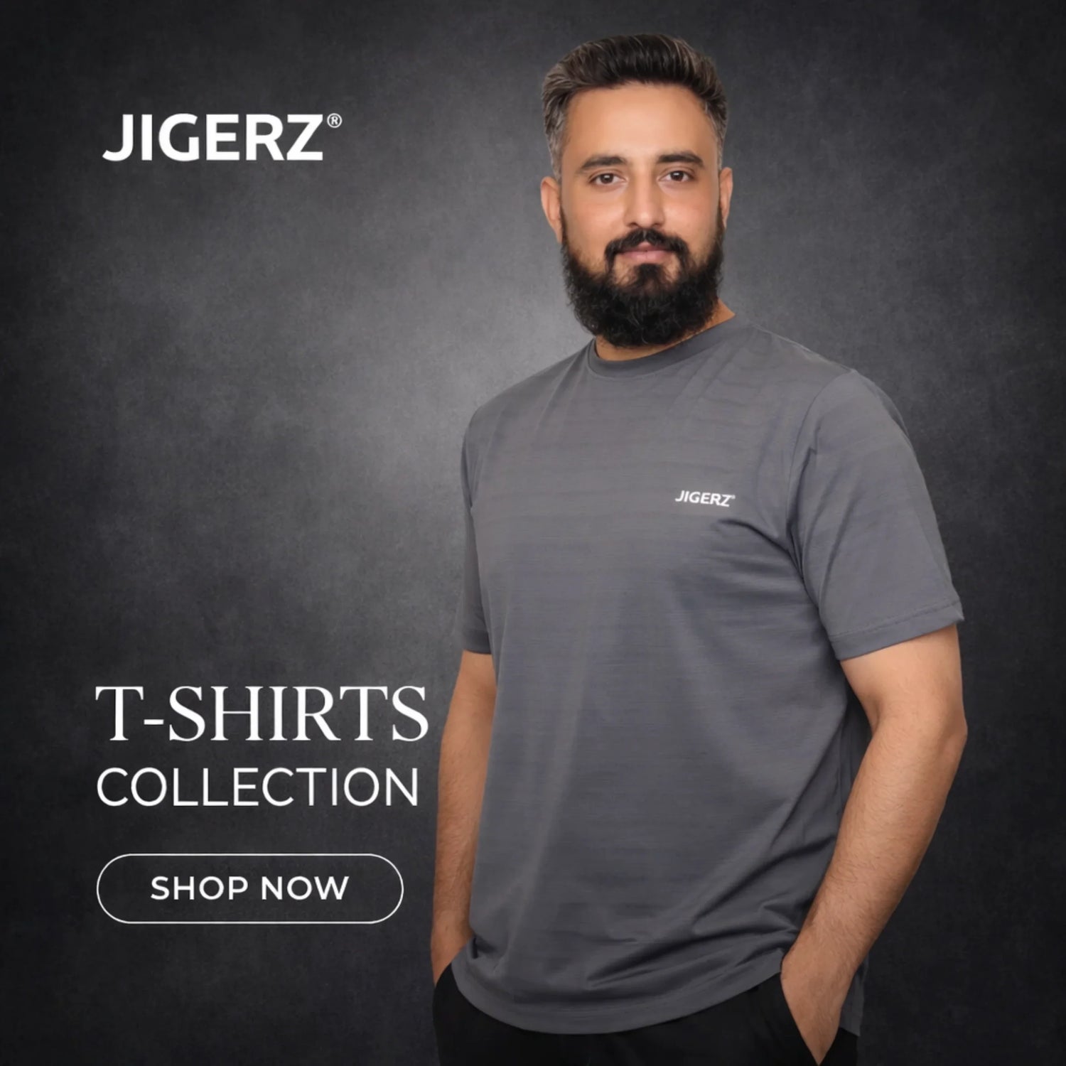 Man with beard wearing a white Jigerz branded t-shirt against a light blue background