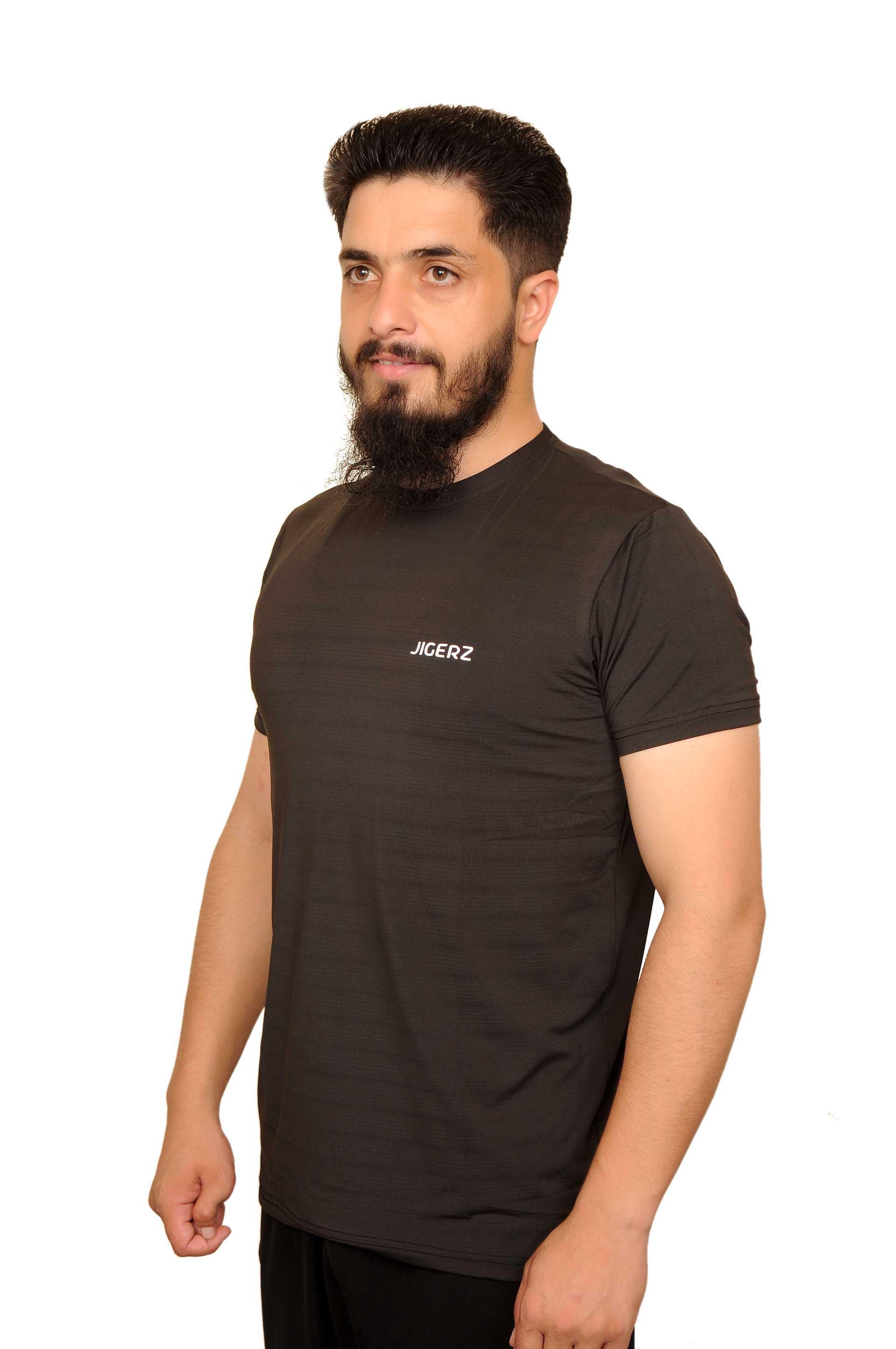 Bearded man wearing black Jigerz t-shirt posing on white background