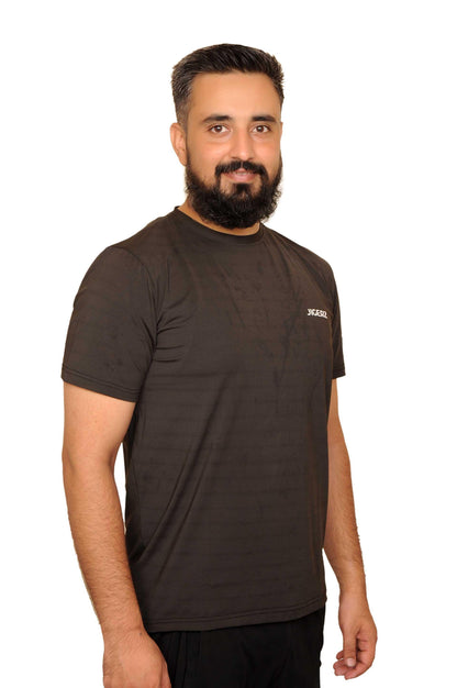 Smiling man with beard wearing black JIGERZ t-shirt against white background