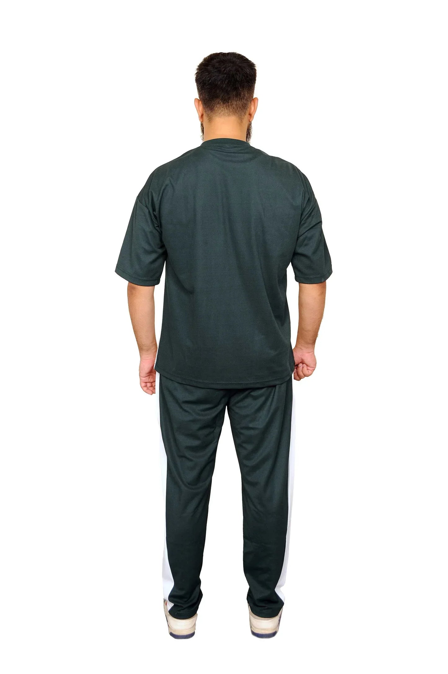 Man wearing black casual t-shirt and black pants with white side stripes, standing back