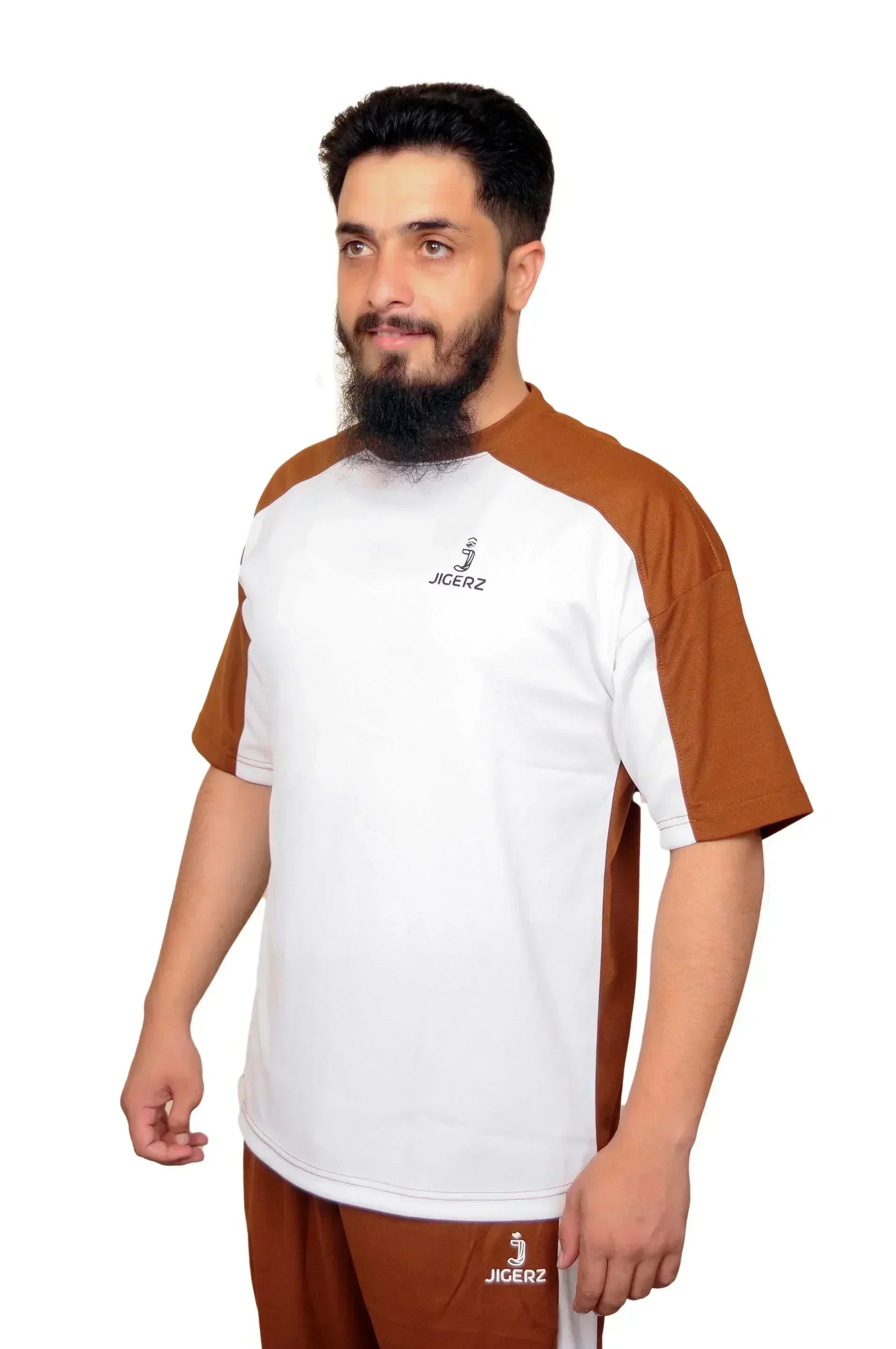 Man wearing brown and white Jigerz sportswear with short sleeves against white background