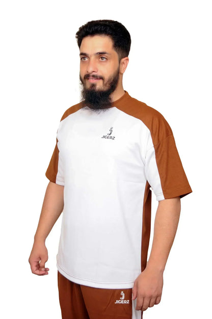 Man wearing brown and white Jigerz sportswear with short sleeves against white background