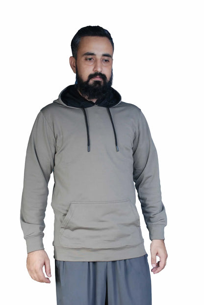 Man with beard wearing grey hoodie with black hood and drawstrings on white background